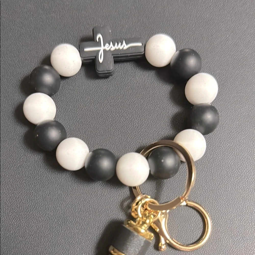 Black and White Beaded Bracelet with Tassel and Jesus cross.